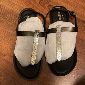 Black and gold Melissa thing sandals